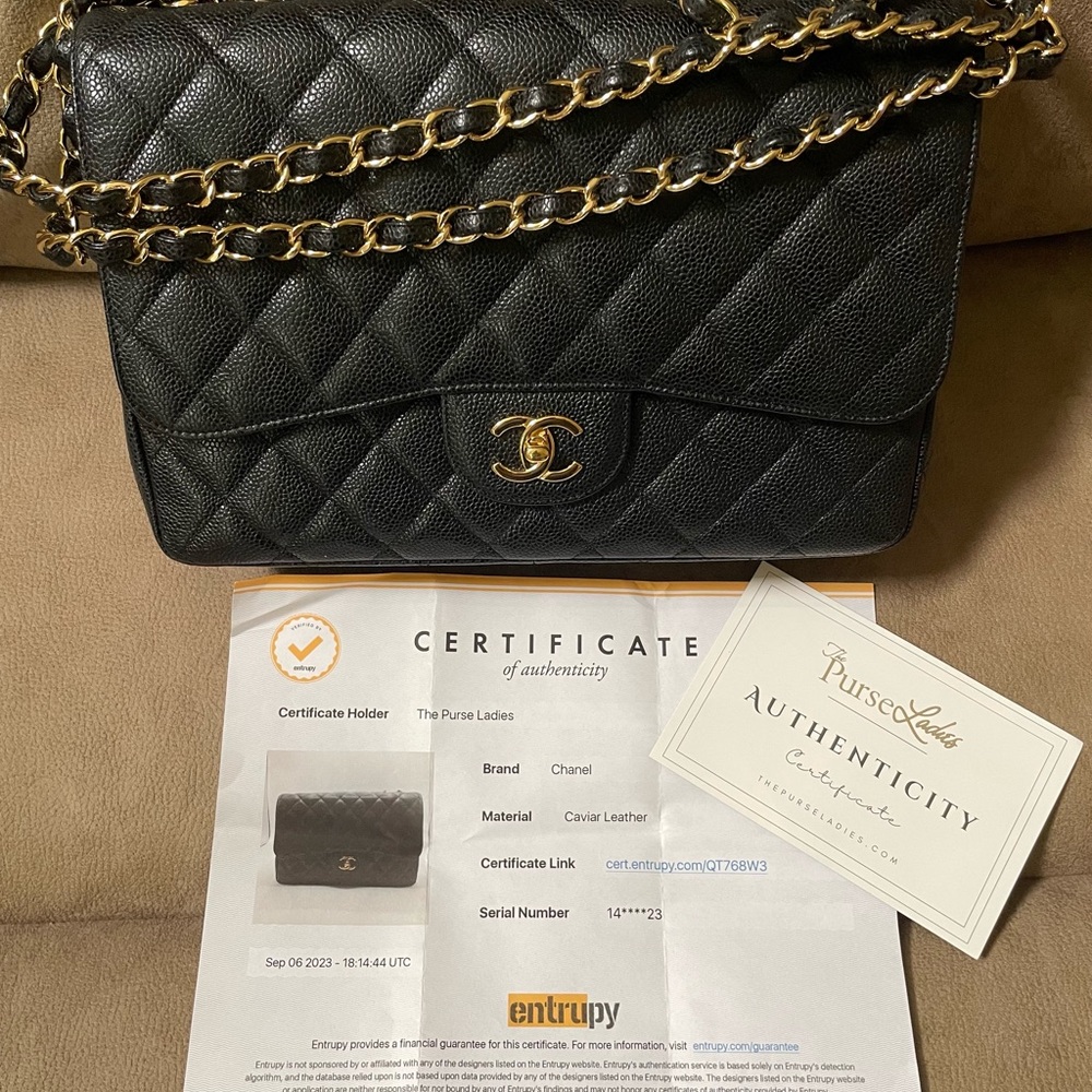 Chanel Classic Black Caviar Jumbo Single Flap bag with Gold Chain.